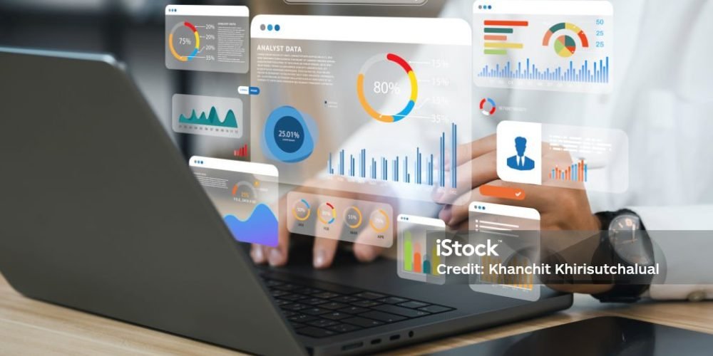 An analyst uses a computer and dashboard for data business analysis and Data Management System with KPI and metrics connected to the database for technology finance, operations, sales, marketing